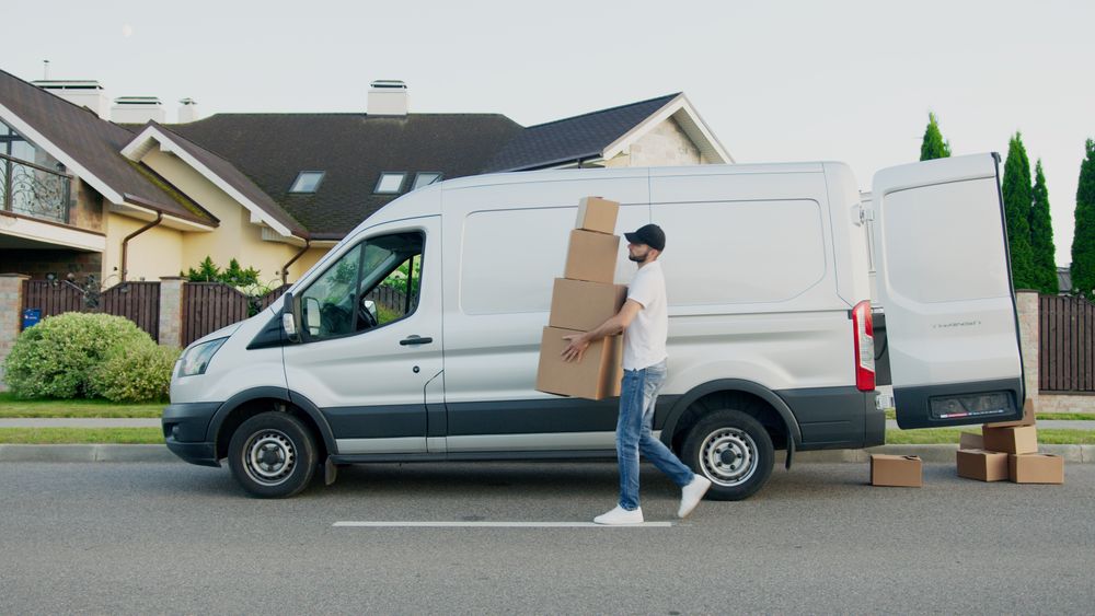 Goods being loaded beside a transport vehicle